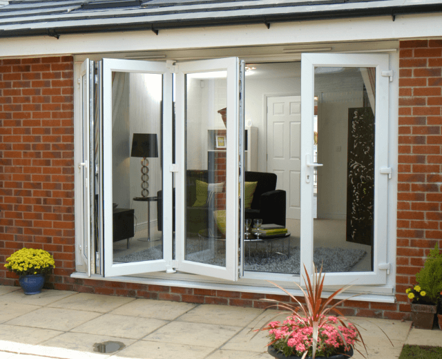 white bi-folding doors open into garden