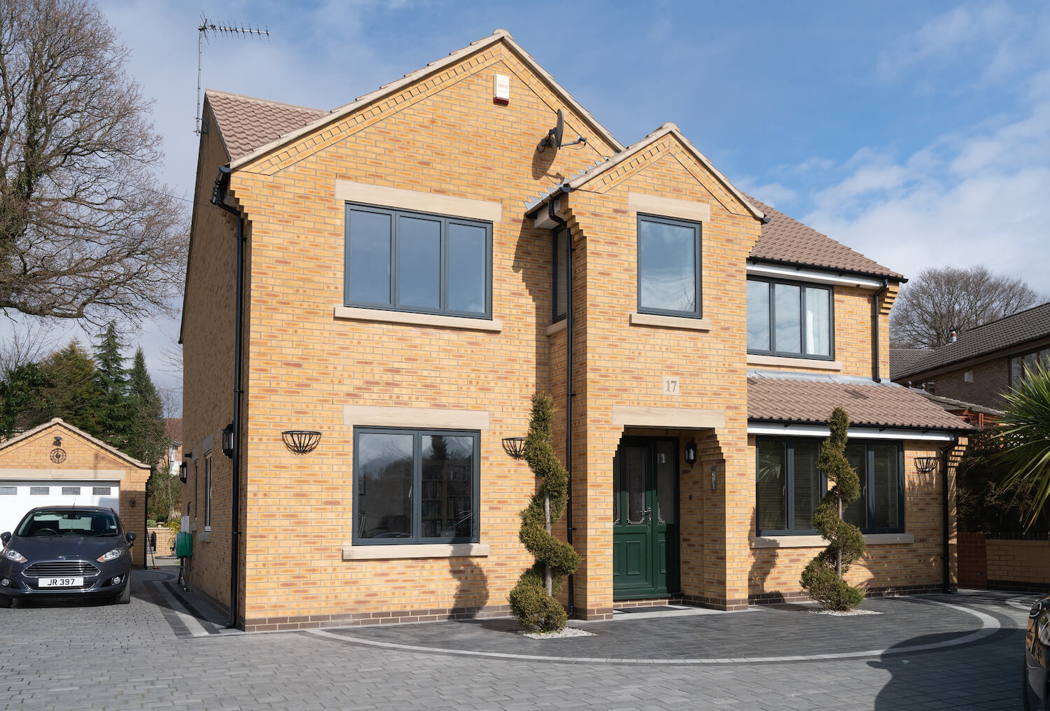modern home with deep green front door